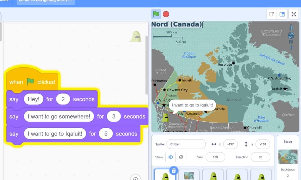 Block code in Scratch with Critter on a map of Nunavut saying "I want to go to Iqaluit!"