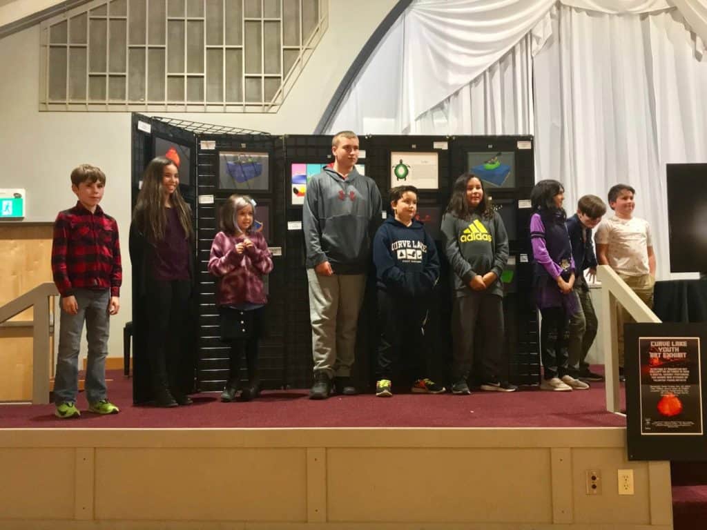 curve lake students on a stage
