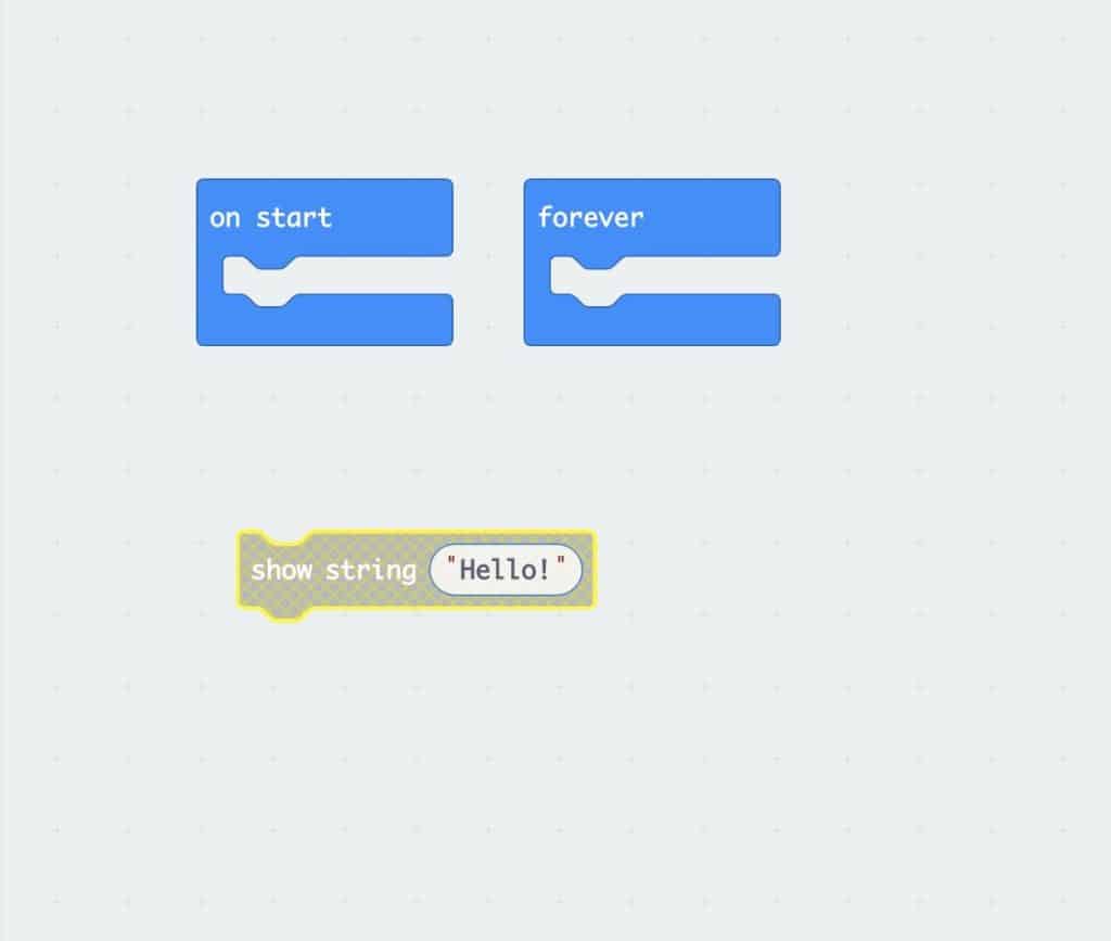 an empty ‘start’ loop beside an empty ‘forever’ loop with a ‘show string “Hello”’ below that is highlighted