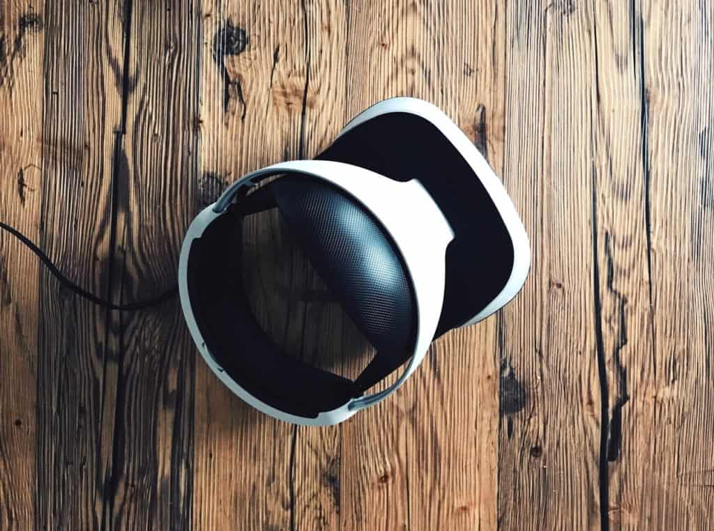 VR headset sitting in the middle of a wooden floor