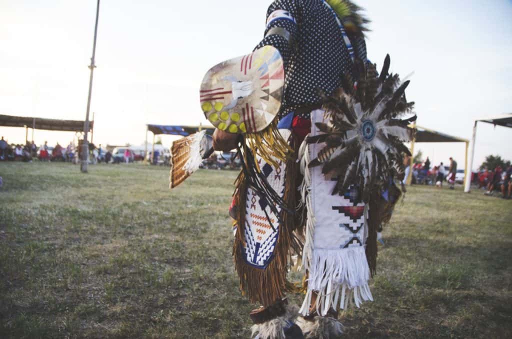 man traditionally dressed to the left of the screen