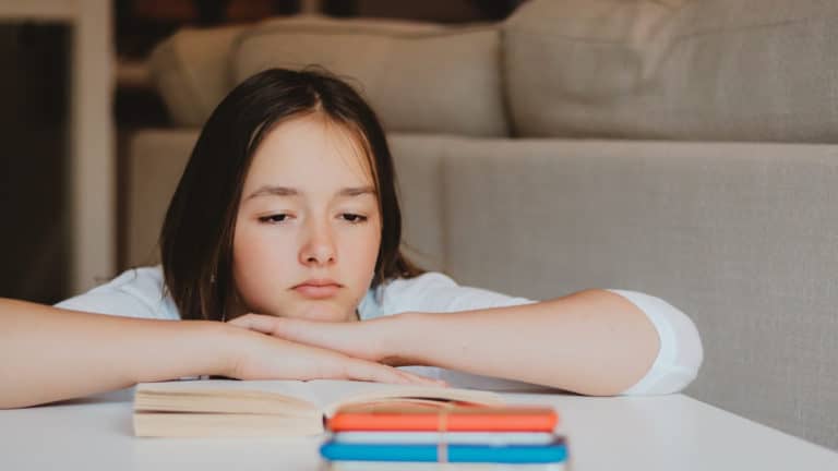 A young person who looks sad.