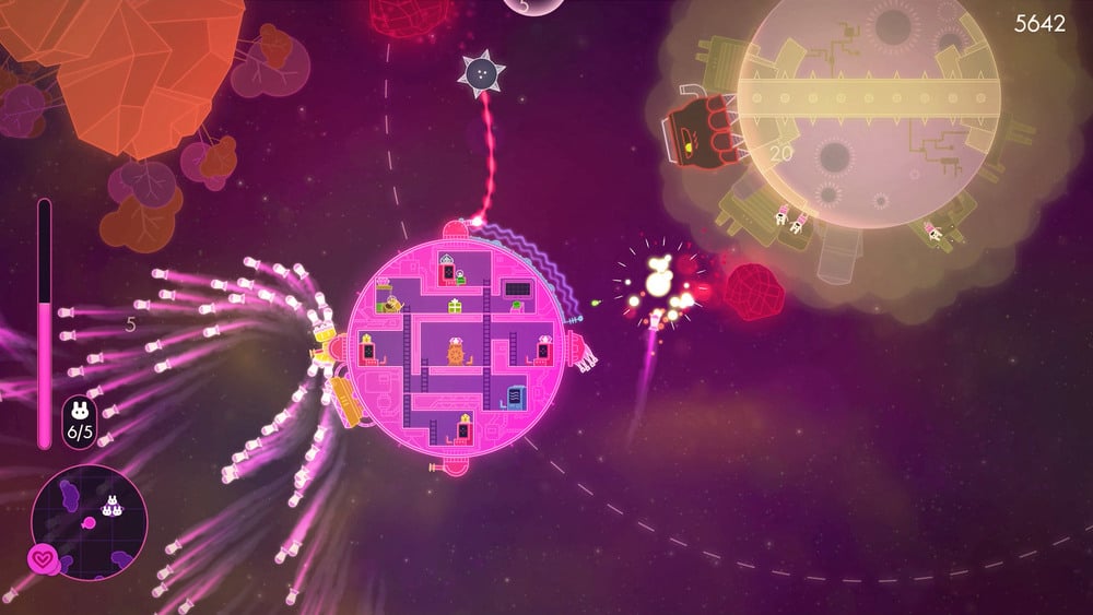 a pink circle flying between planets 