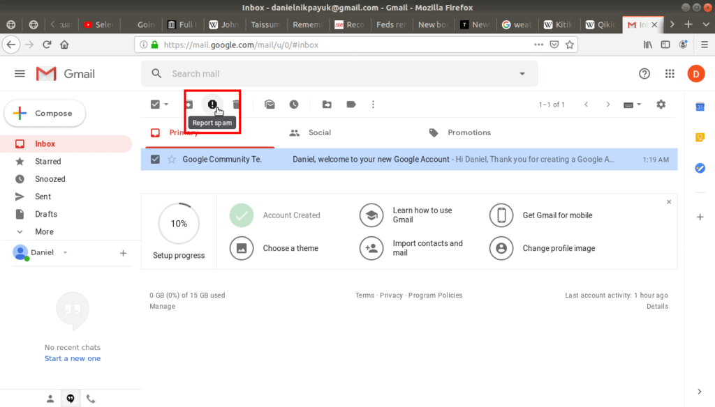 Report spam highlighted in gmail's tool bar.