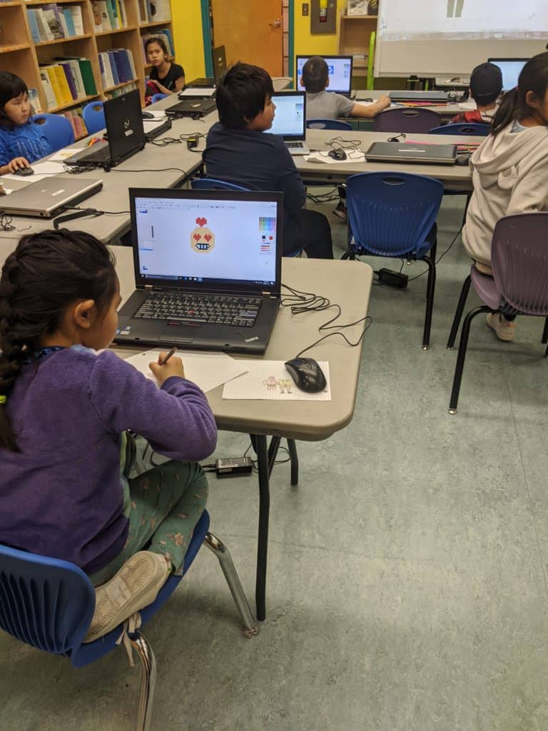 A student creating digital art using a computer.