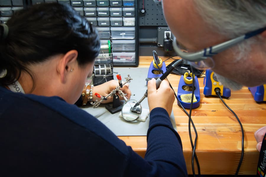People working on a project in The Garage.