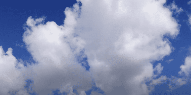 Bright white clouds in a blue sky.