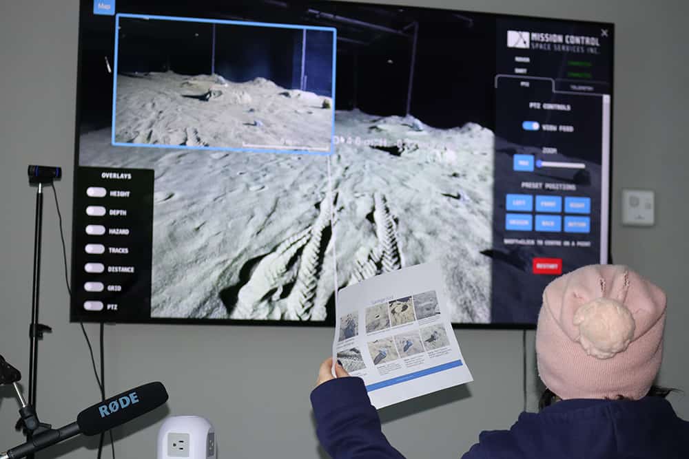 Students learning how to operate a rover on Mars during a production demonstration from a MCSS-Pinnguaq collaboration