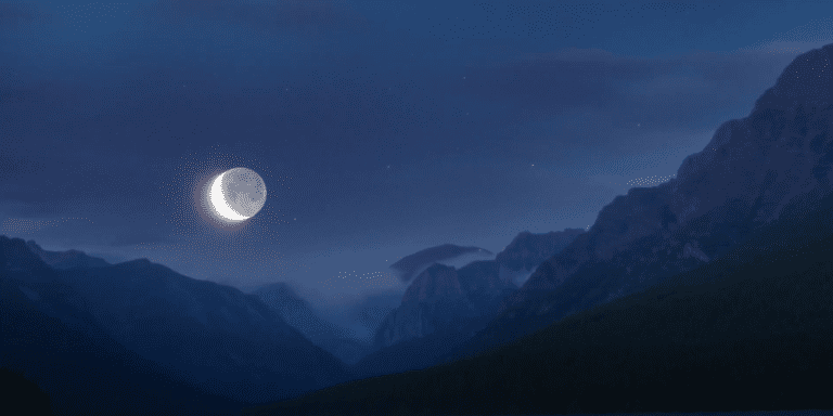 An eclipse with mountains surrounding it.