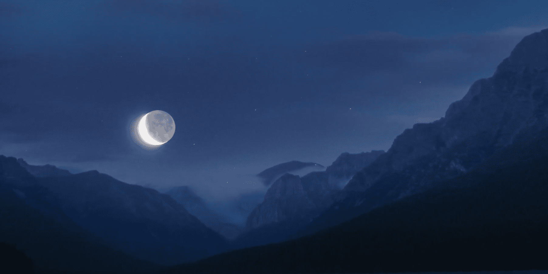 An eclipse with mountains surrounding it.