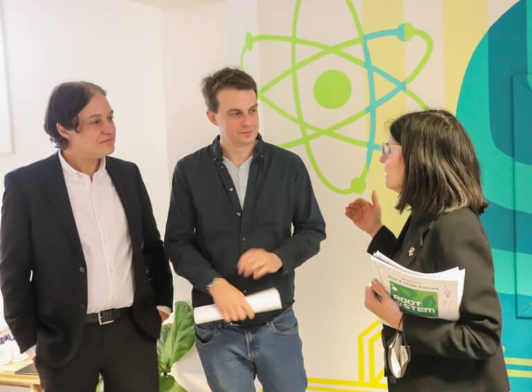 CEO, and board member talking with someone from the government of canada.