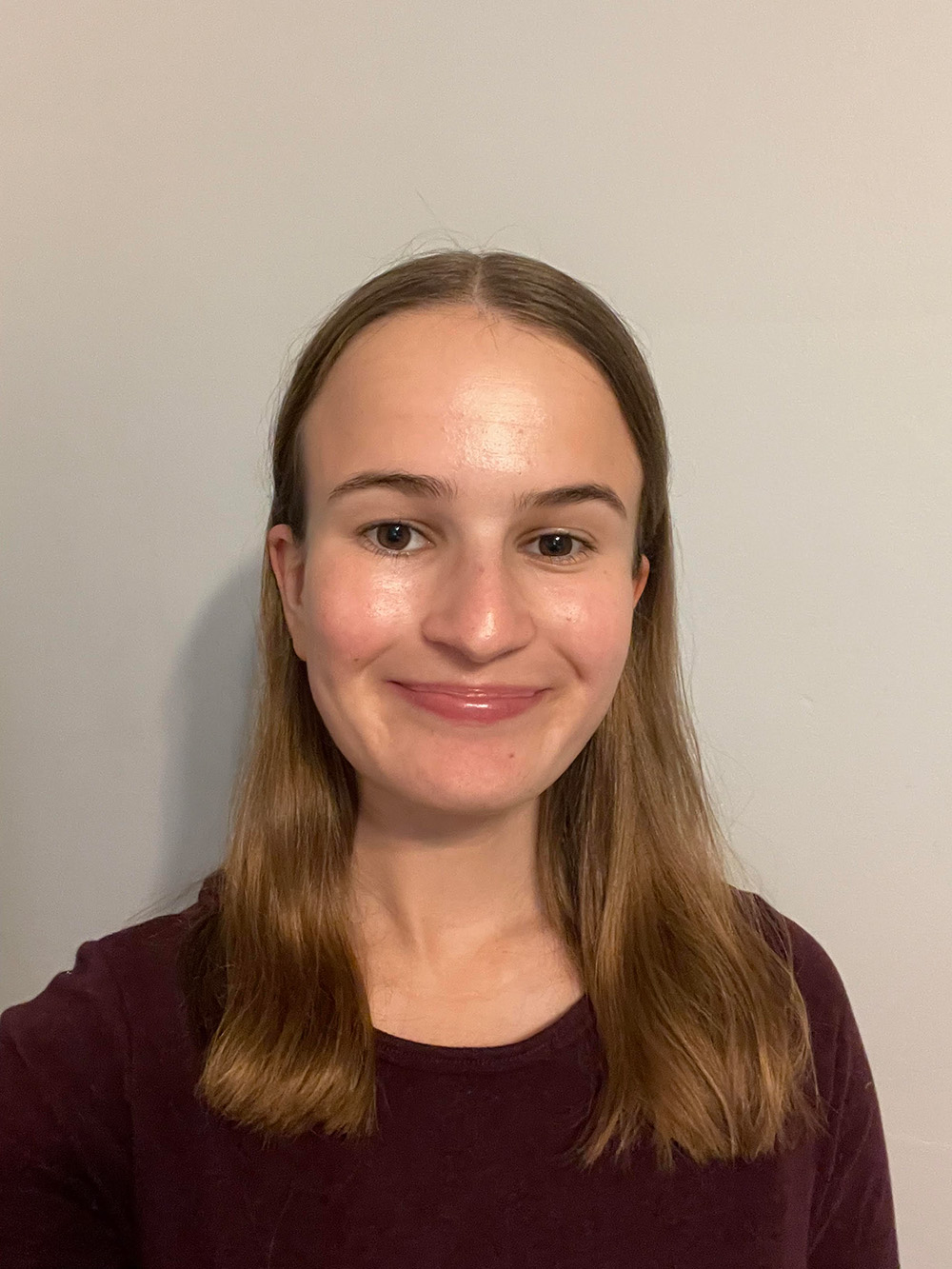 A portrait of Chloe Phillips, she is smiling.